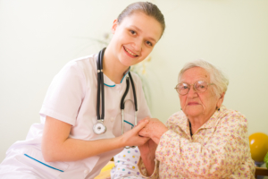 elderly and a nurse smiling